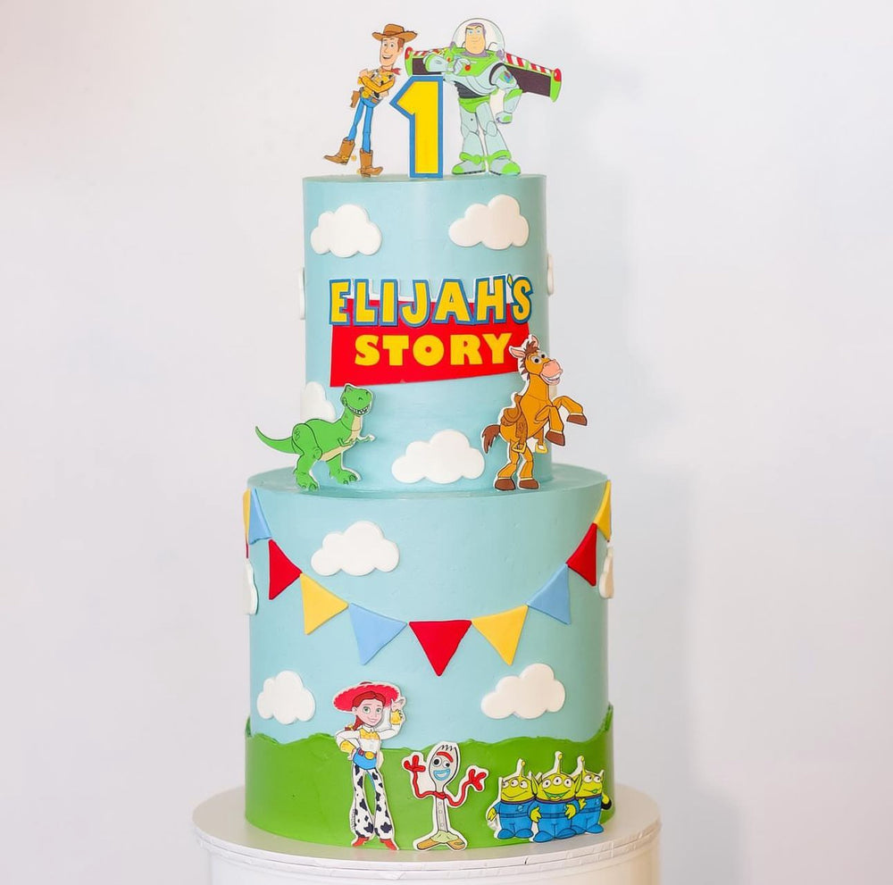 2 tier -9" x 4 layer + 6" x 4 layer - Toy Story with edible prints, acrylic topper, fondant clouds/bunting and icing fault line