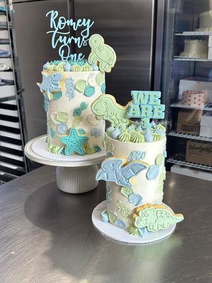 6" x 4 layer - Smears + icing on top + acrylic toppers + themed cookie toppers + sprinkles