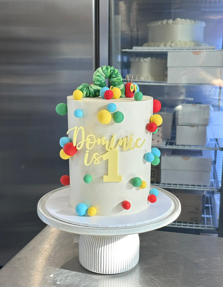6" x 4 layer + fondant figurine + fondant details + front acrylic topper