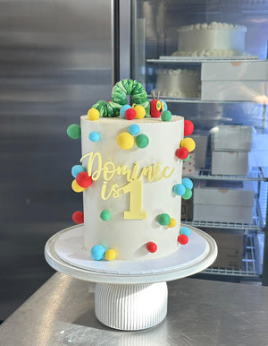 6" x 4 layer + fondant figurine + fondant details + front acrylic topper
