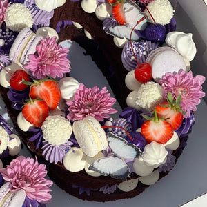 Add cherries, glitter cherries, strawberries, fresh flowers, butterflies