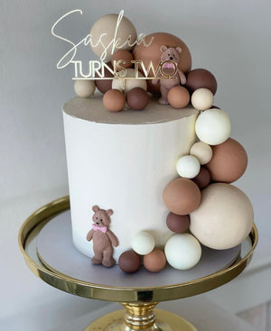 2 x silicon teddies with choc spheres and Gold topper
